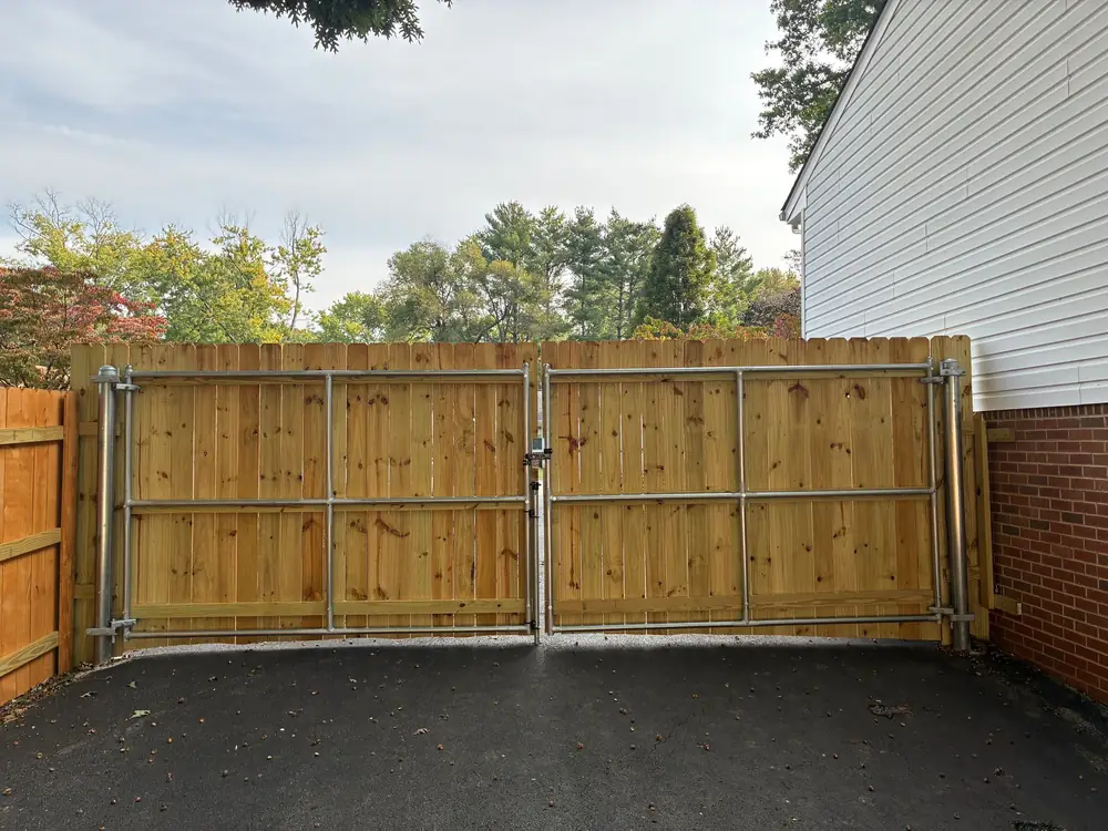 Entrance gate and short fence installed by Star City Fence Co