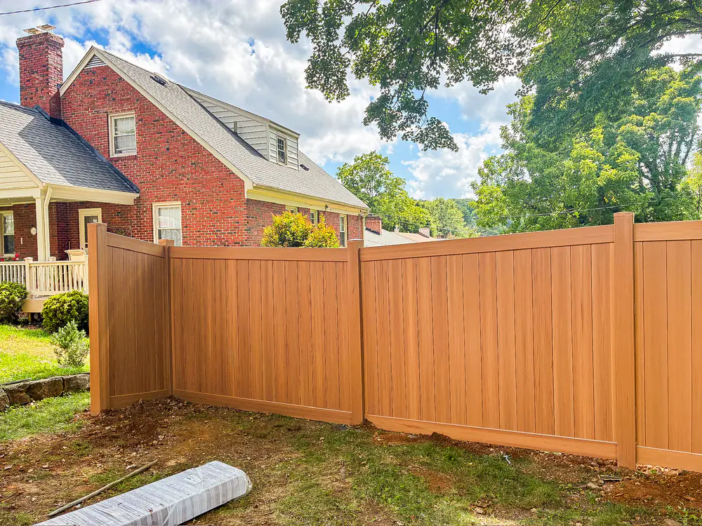 Wood-grain textured decorative vinyl privacy fence