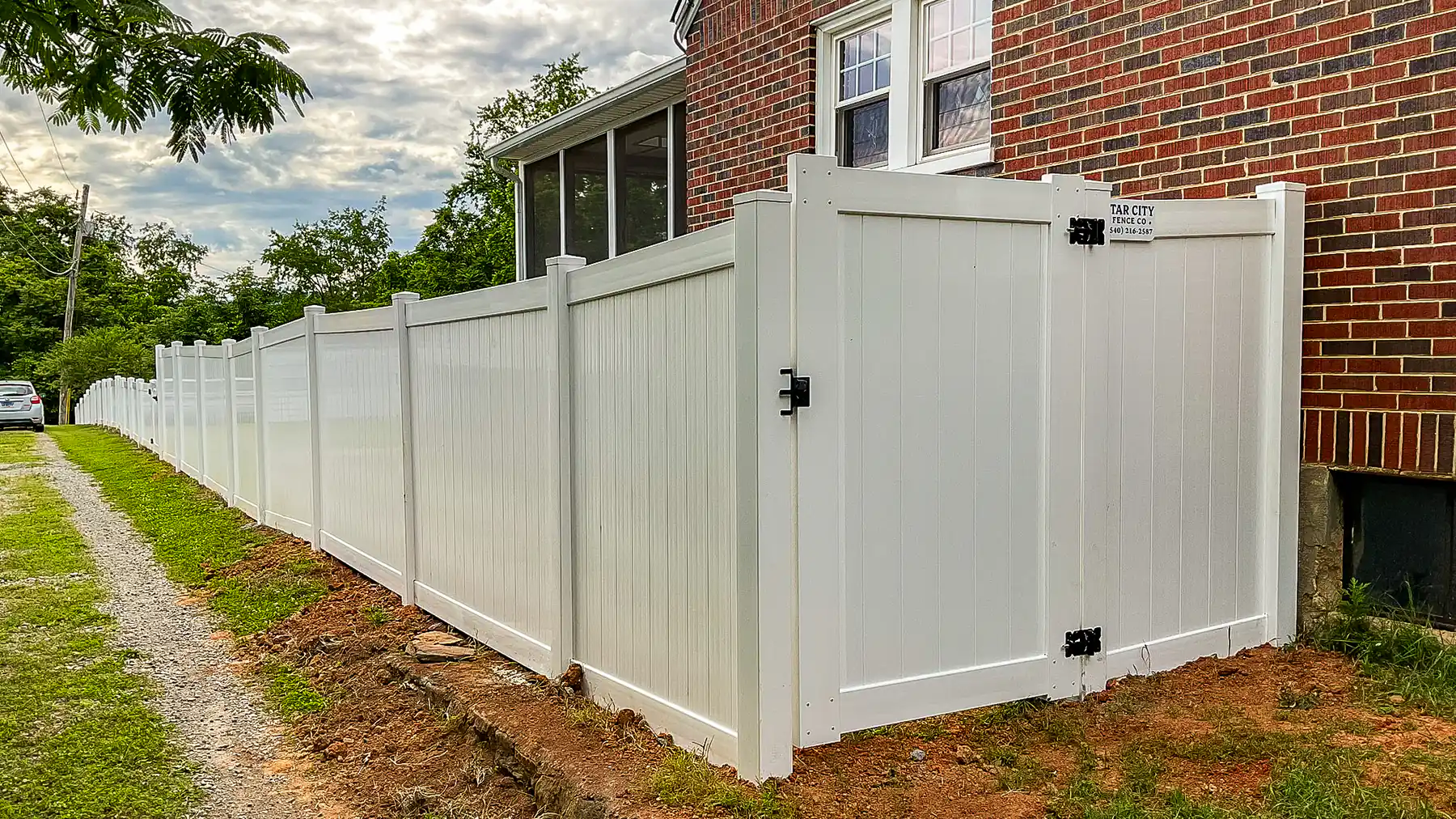 White vinyl privacy fence installed by Star City Fence Co