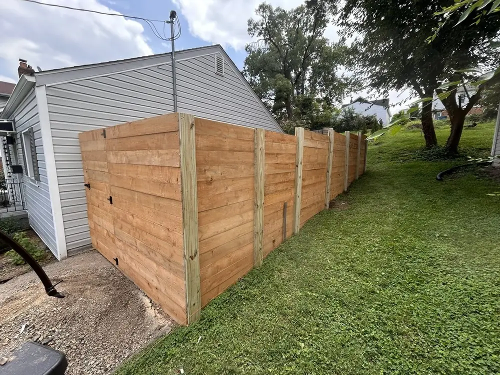 Wood privacy fence installed by Star City Fence Co
