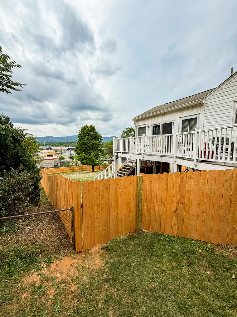 Wood privacy fence on a hillside lot overlooking the Roanoke valley