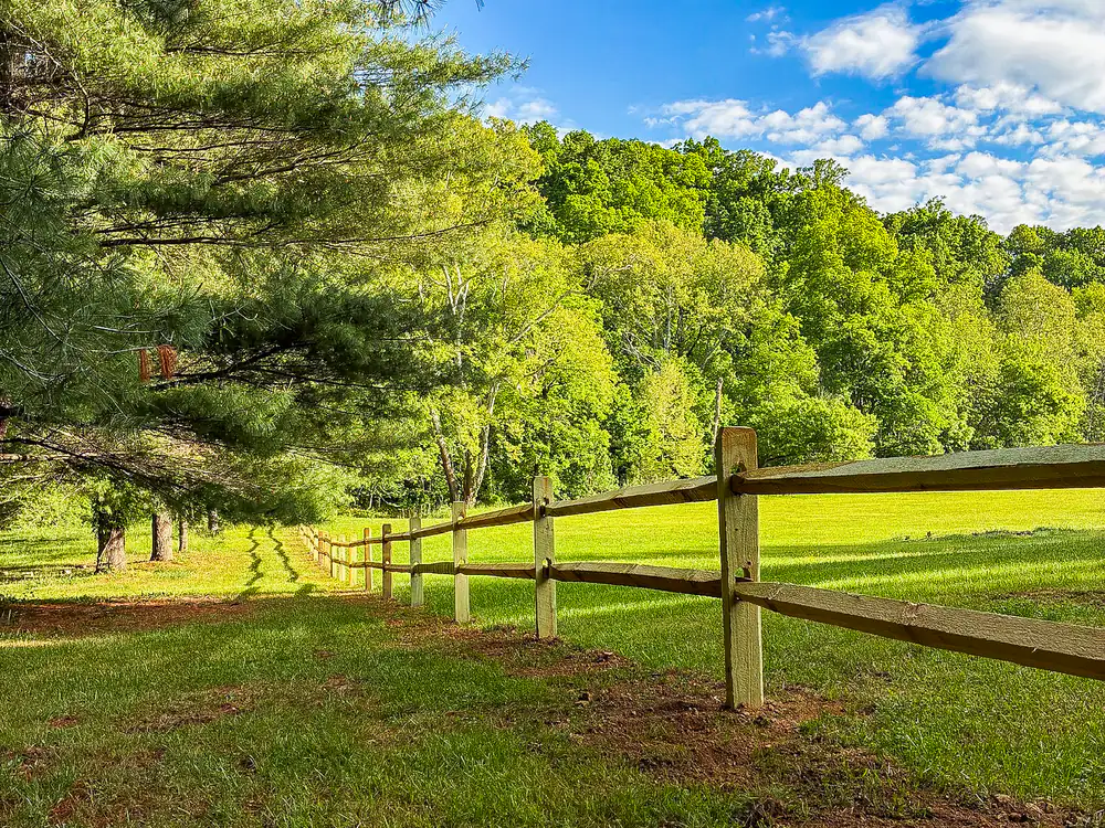 Split rail wood fence along a mowed pasture in Botetourt County